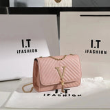 Quilted V-Tassel Chain Clutch - VELLEGRA