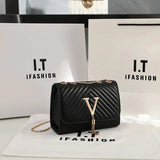 Quilted V-Tassel Chain Clutch - VELLEGRA