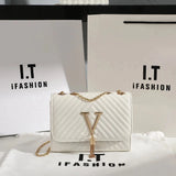 Quilted V-Tassel Chain Clutch - VELLEGRA